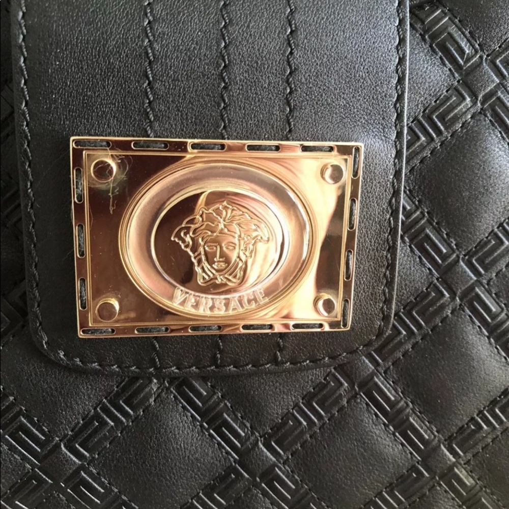Versace black leather brand new never worn